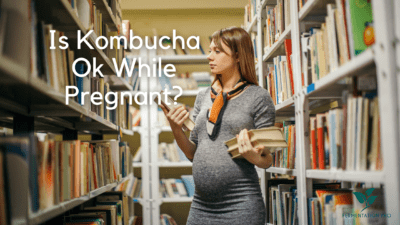 Young pregnant woman working library