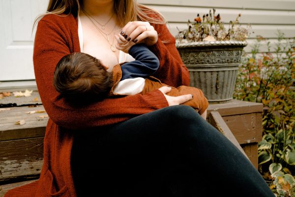 a woman breastfeeding her infant