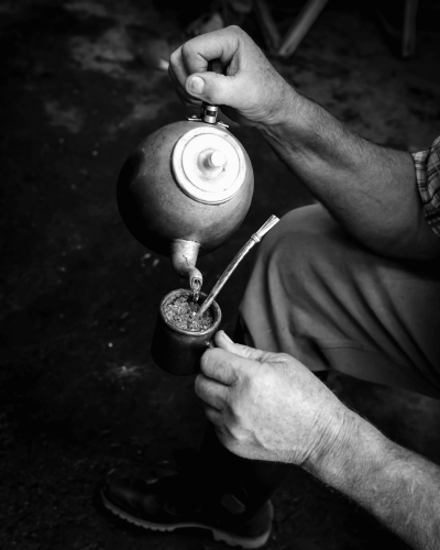 pouring hot water into yerba mate